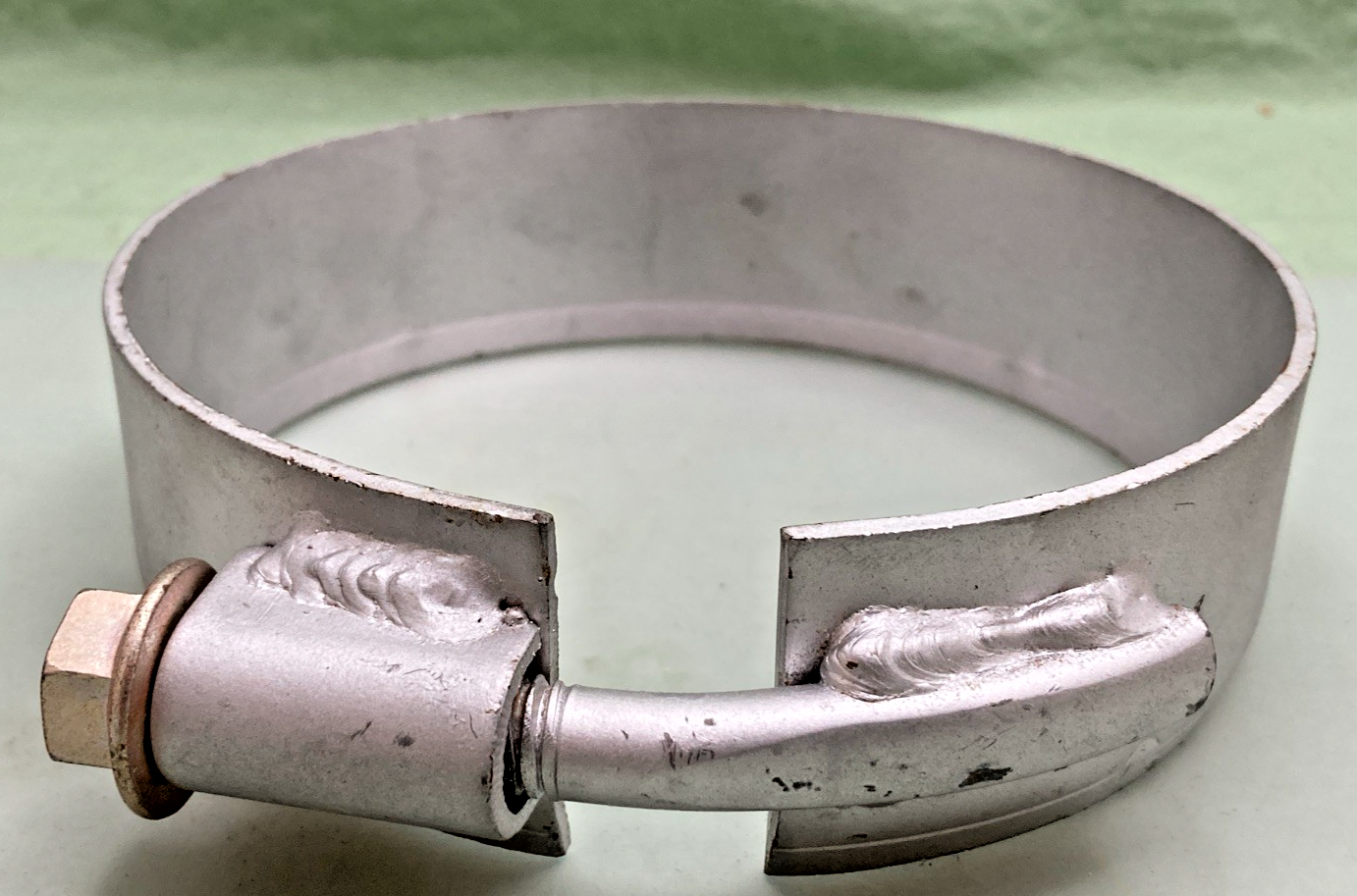 New Genuine Donaldson M001865 Exhaust Clamp - Bent Bolt Style